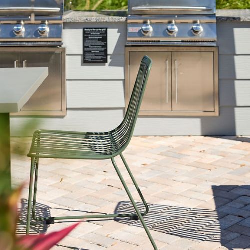 Outdoor kitchen with grills and seating