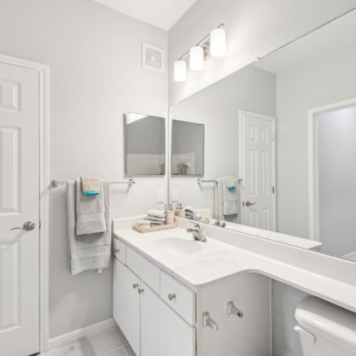 A  modern master bathroom with clean white styling 