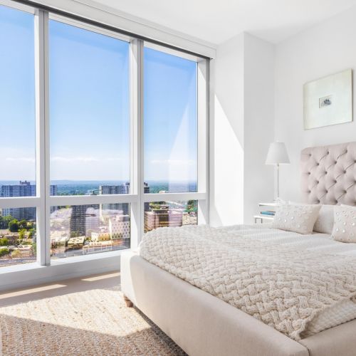 Bedroom with floor to ceiling windows