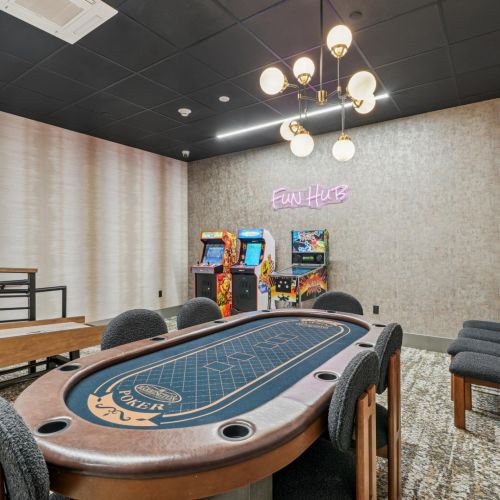 Game room with card table and arcade games