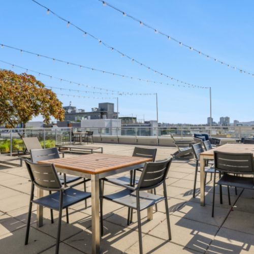 Eleanor Seattle rooftop lounge with city skyline view