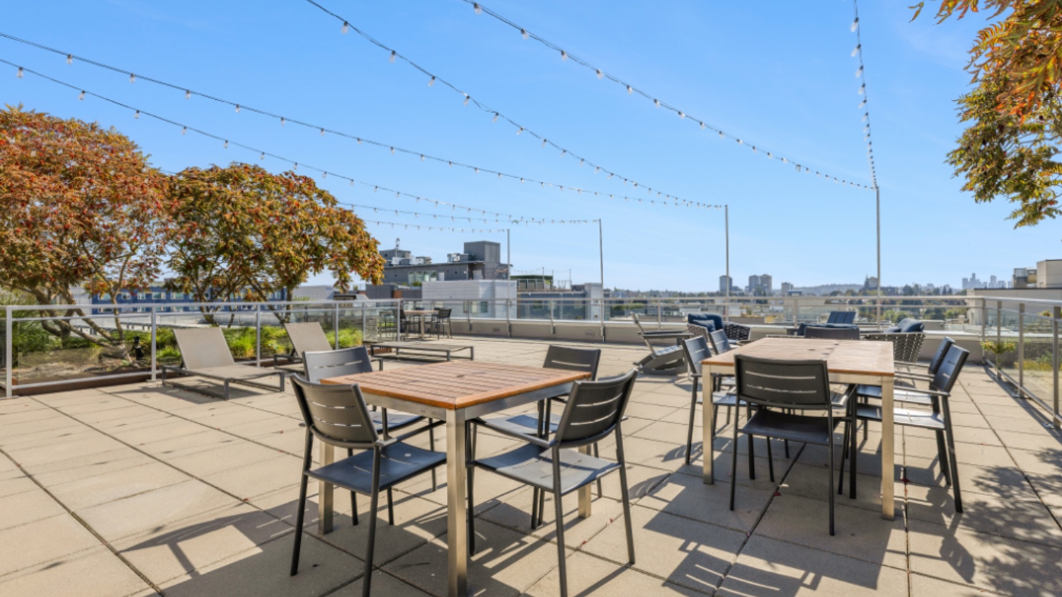 Eleanor Seattle rooftop lounge with city skyline view