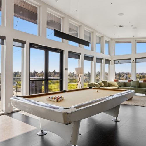 Community lounge with pool table at Eleanor Apartments in Seattle