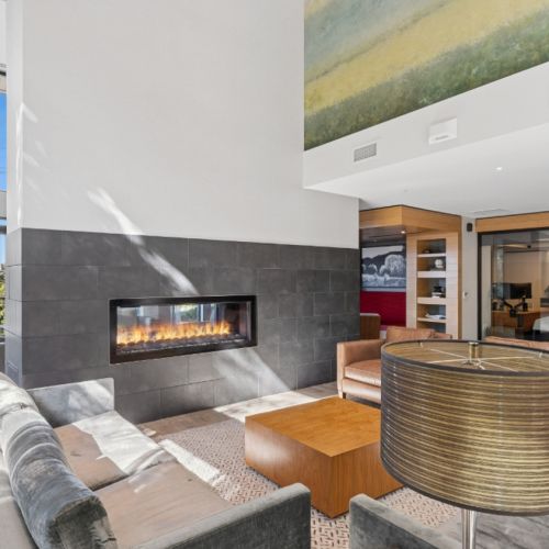 Spacious resident lounge with couches and chairs at Eleanor in Seattle