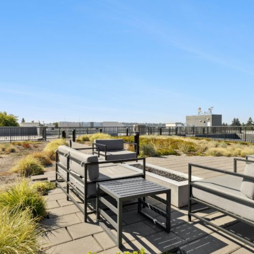Rooftop firepit lounge at Smith & Burns Seattle with city views