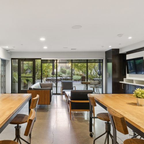 Amenity lounge at Smith & Burns Seattle apartments with modern seating