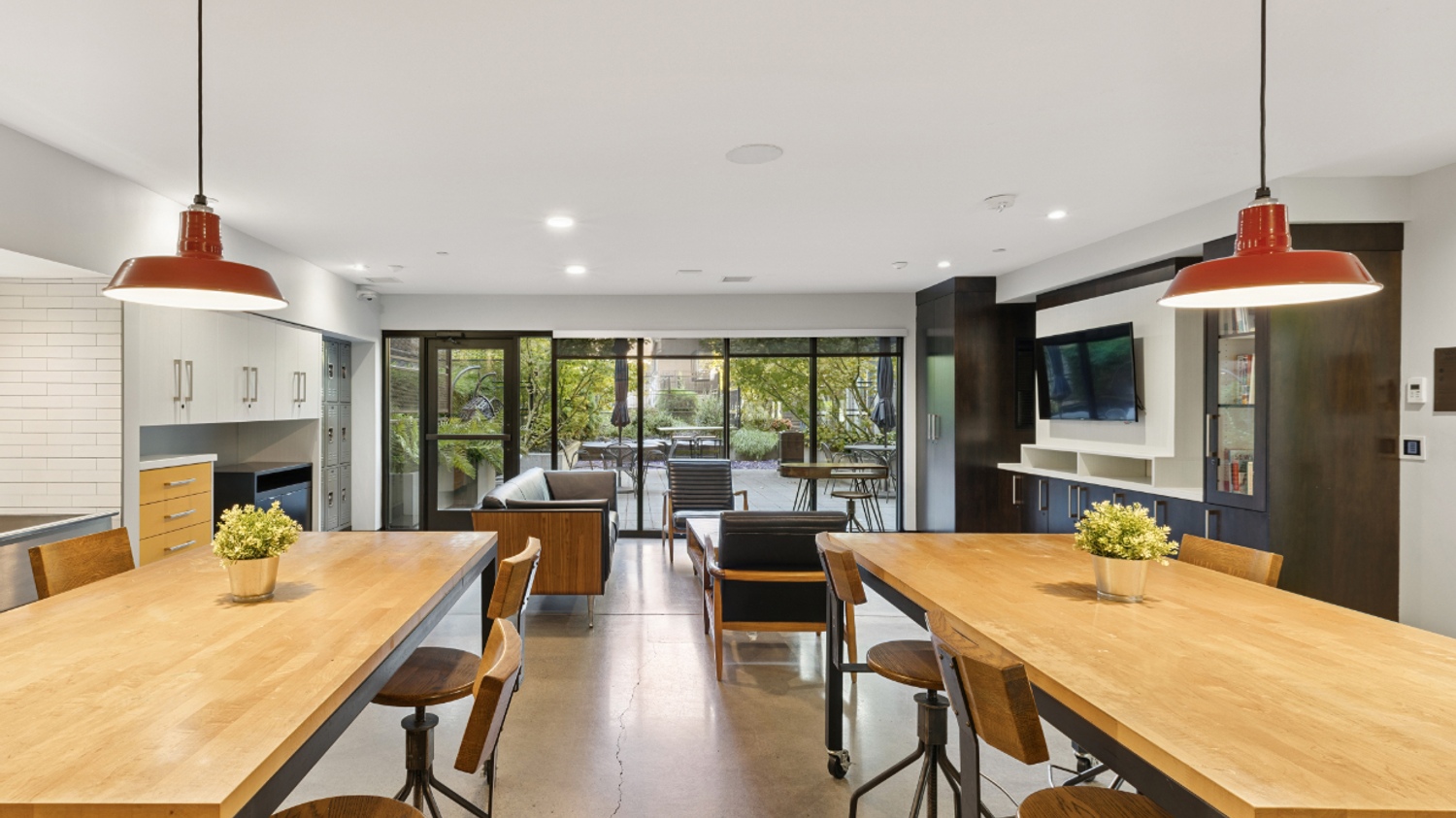 Amenity lounge at Smith & Burns Seattle apartments with modern seating