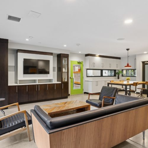 Modern amenity lounge for residents at Smith & Burns apartments in Seattle