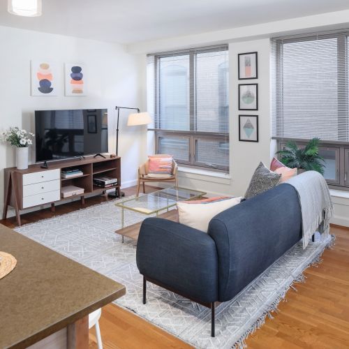 Contemporary comfort meets city sophistication in this open-concept living space.