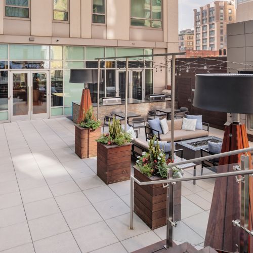 Fireside ambiance and sweeping city views create the perfect night in.