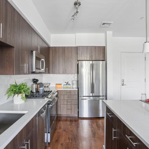 Closeup view of sink, Island and cabinets
