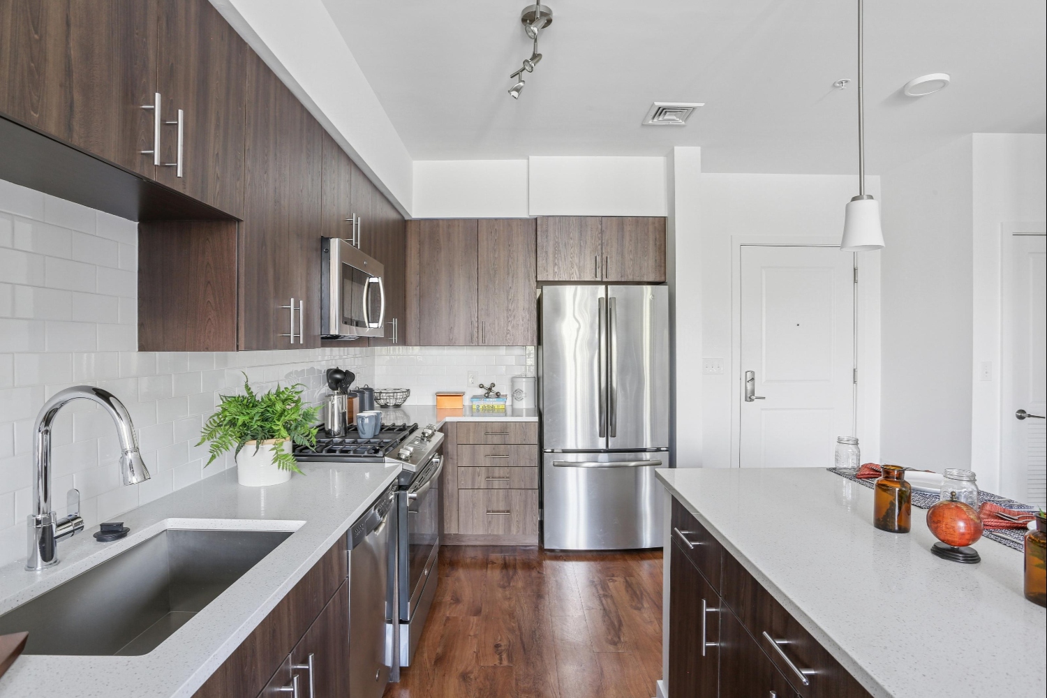 Closeup view of sink, Island and cabinets