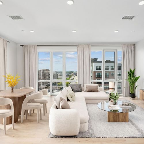 sleek finishes, a spacious island, and expansive windows