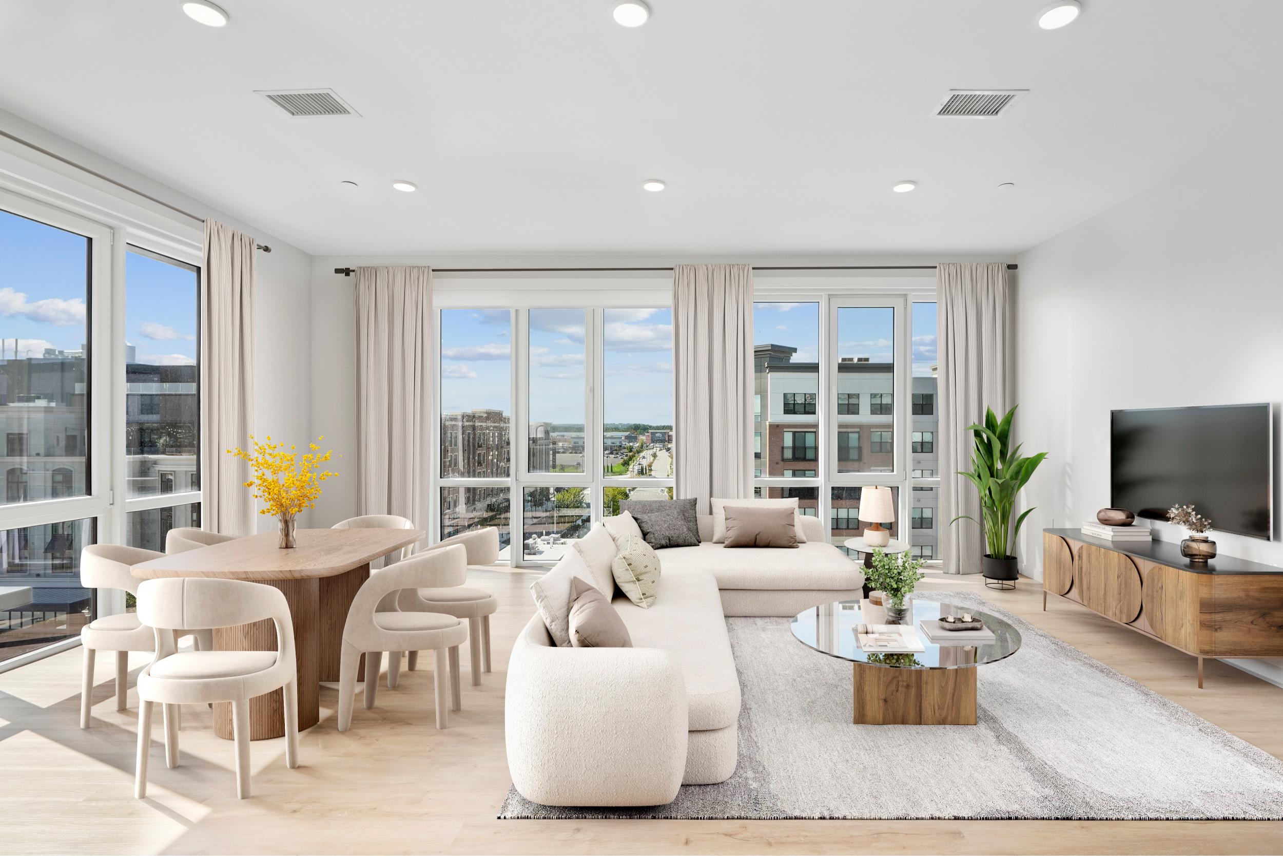 sleek finishes, a spacious island, and expansive windows