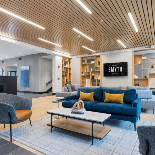 Lush seating, a sleek fireplace, and custom shelving