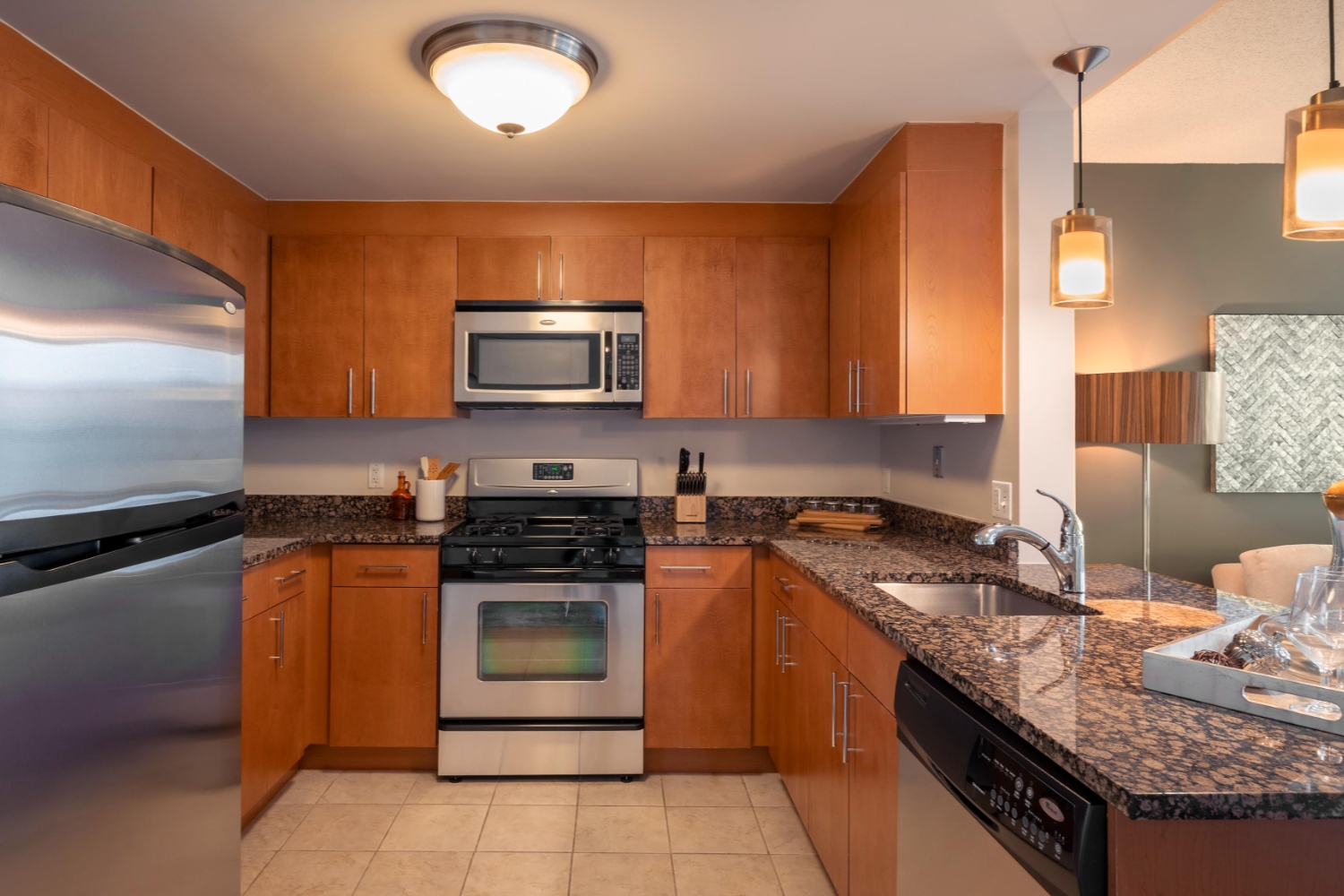 Kitchen with tile flooring and granite countertops