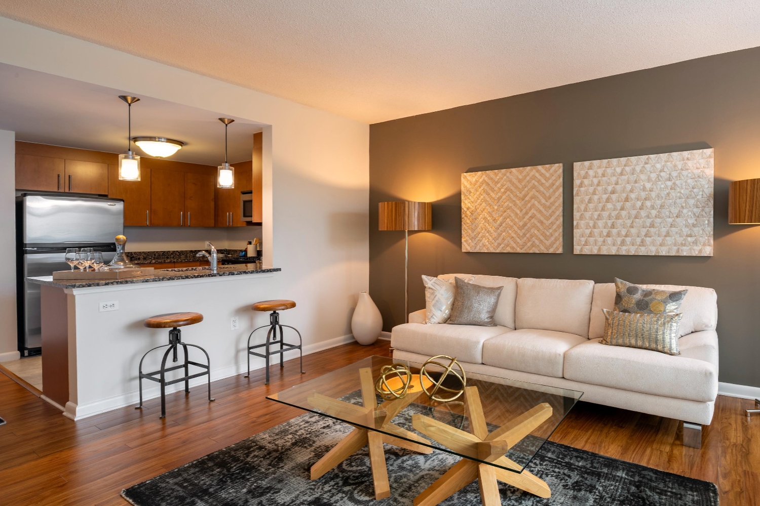 Living room with vinyl plank flooring and view of kitchen
