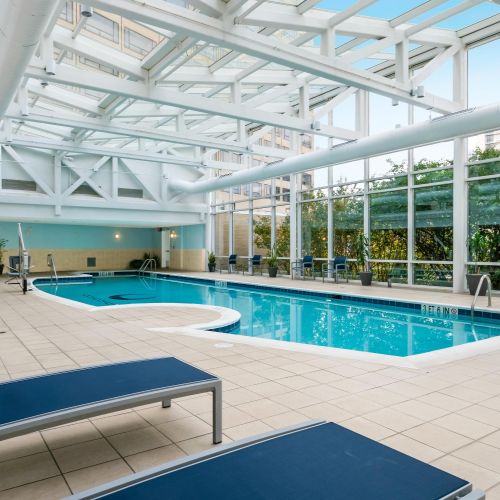 Indoor pool with lounge chairs 